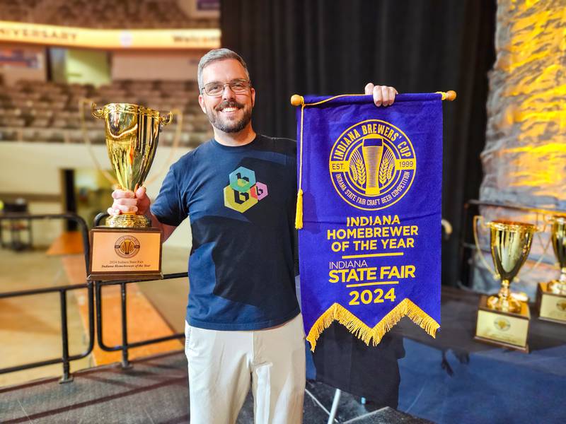 Indiana Homebrewer of the Year winner Metts Potter holds a trophy earned for his award-winning brews.