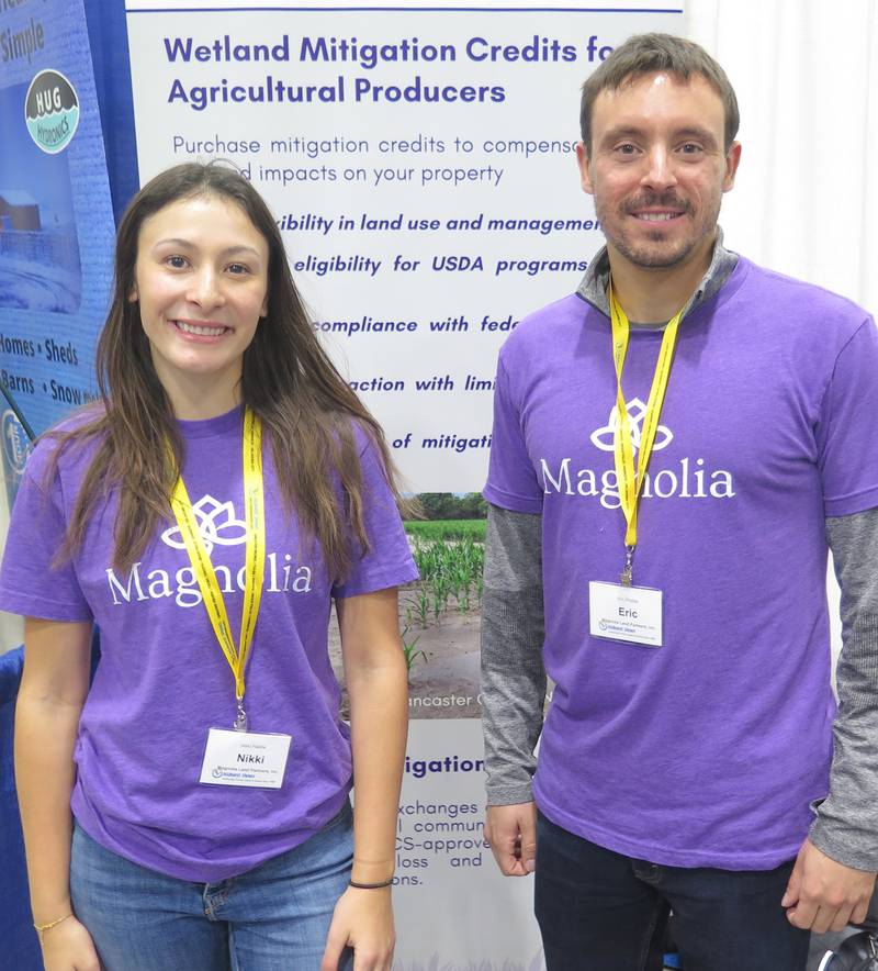 Nikki Palella, analyst, and Eric Phillips, land development manager, described the Magnolia Land Partners' wetland mitigation bank program at their booth during the Greater Peoria Farm Show.