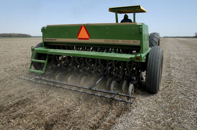 Mearl McCartney plants soybeans using a no-till drill near Bowling Green, Ohio.