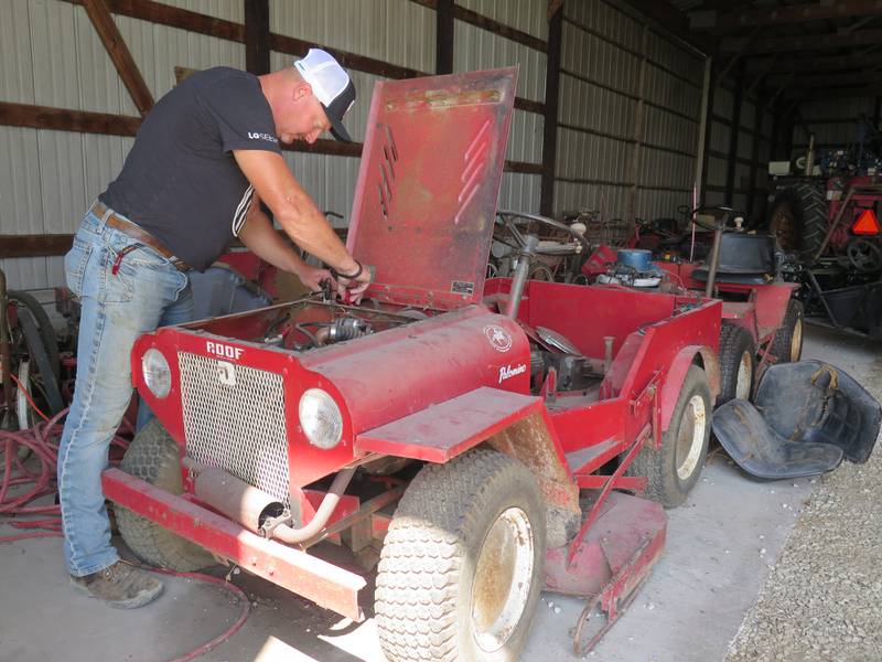 Aaron Rients works on his Roof Palomino mower to get it ready for the Threshermen’s Reunion. His grandfather, Lowell Sidfrids, was a long-time engineer at the Roof Manufacturing Company in Pontiac, Illinois.