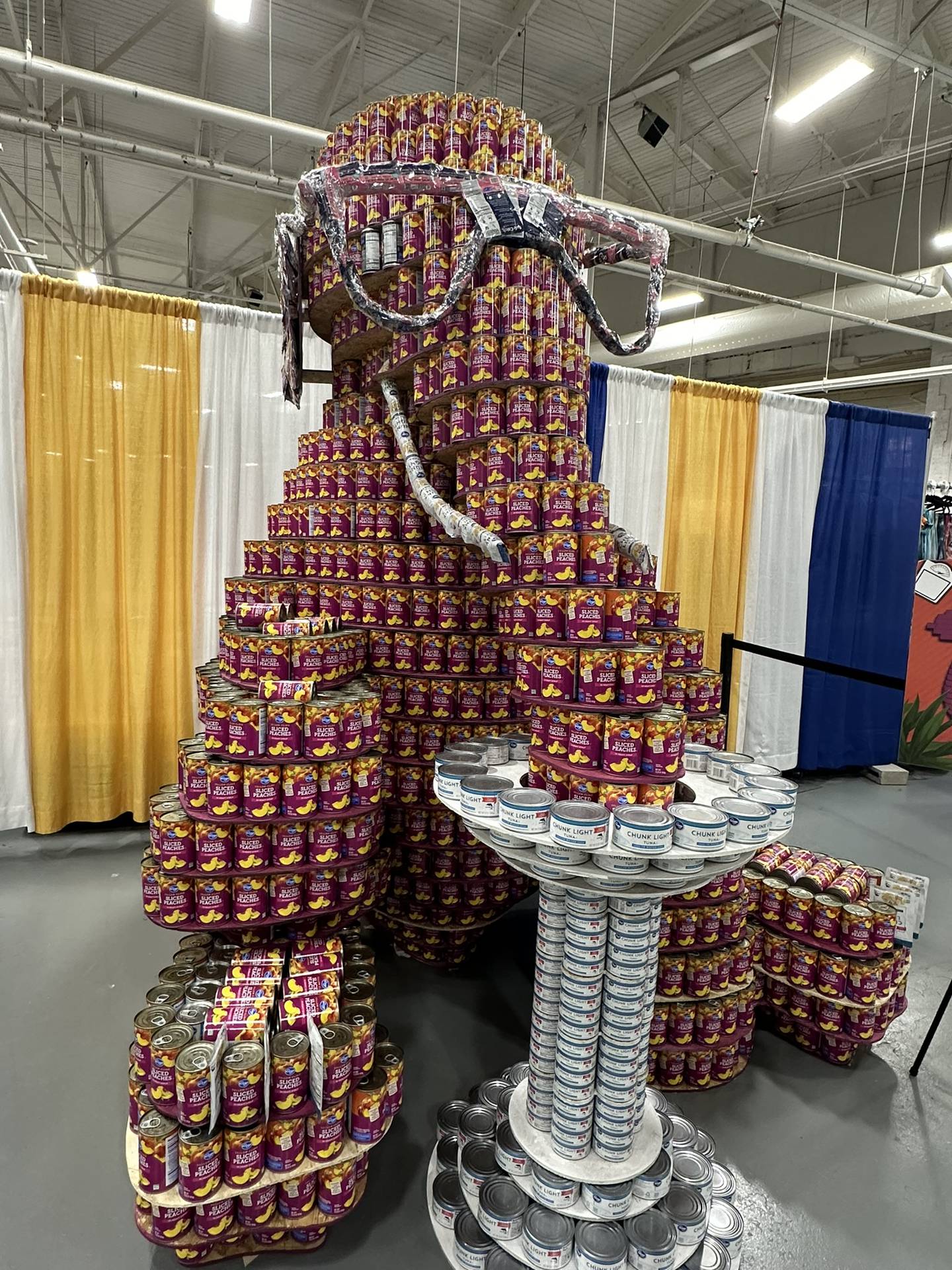 An elephant sculpture was made using 3,686 cans, including healthy foods like peaches, beans, tuna and salmon. After the fair, the food cans were donated to Gleaners Food Bank.