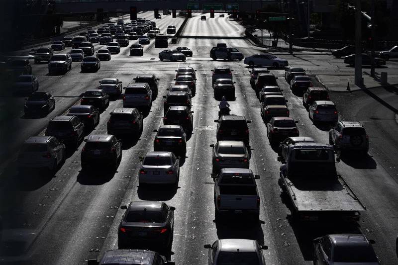 Cars wait at a red light during rush hour in Las Vegas.