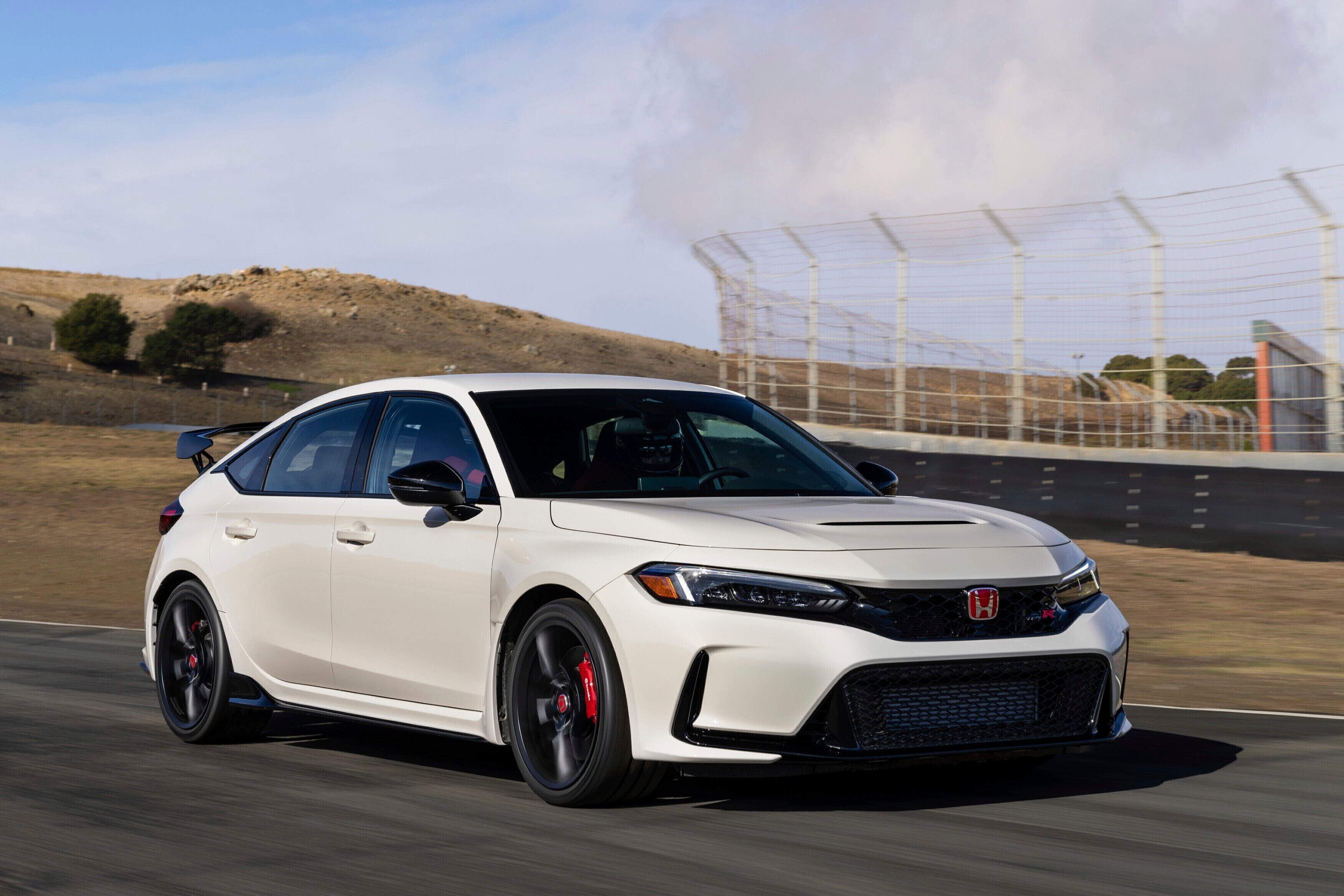 The 2024 Honda Civic Type R is loads of fun to drive thanks to its nimble handling and standard manual transmission. On top of that you get hatchback-based practicality and distinct styling.