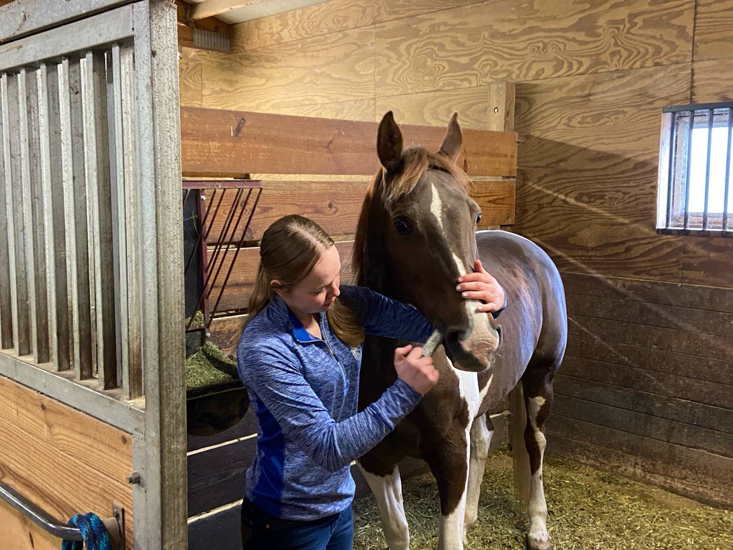 Ellorie Drach cares for her Paint mare named River that she competes with at rodeos on the local, state and national levels.