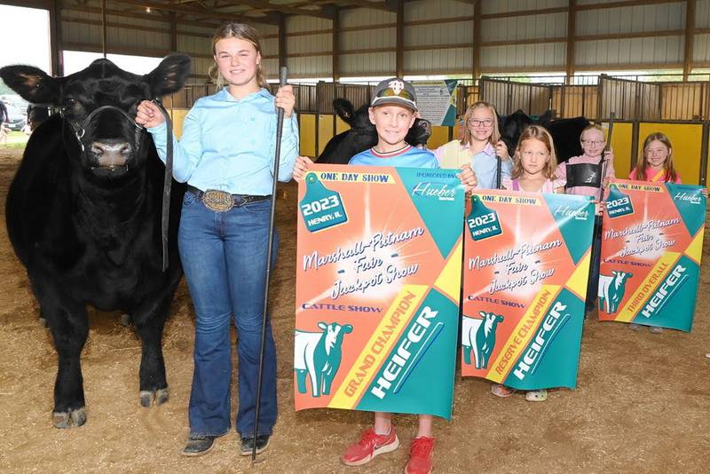 The top three Angus heifers entered in the Marshall-Putnam Fair Beef Jackpot Show line up for a photo at the conclusion of the 2023 judging. The livestock show also features sheep, goats, swine, horses and rabbits.