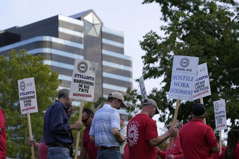 United Auto Workers march outside the Stellantis North American Headquarters in Auburn Hills, Michigan.