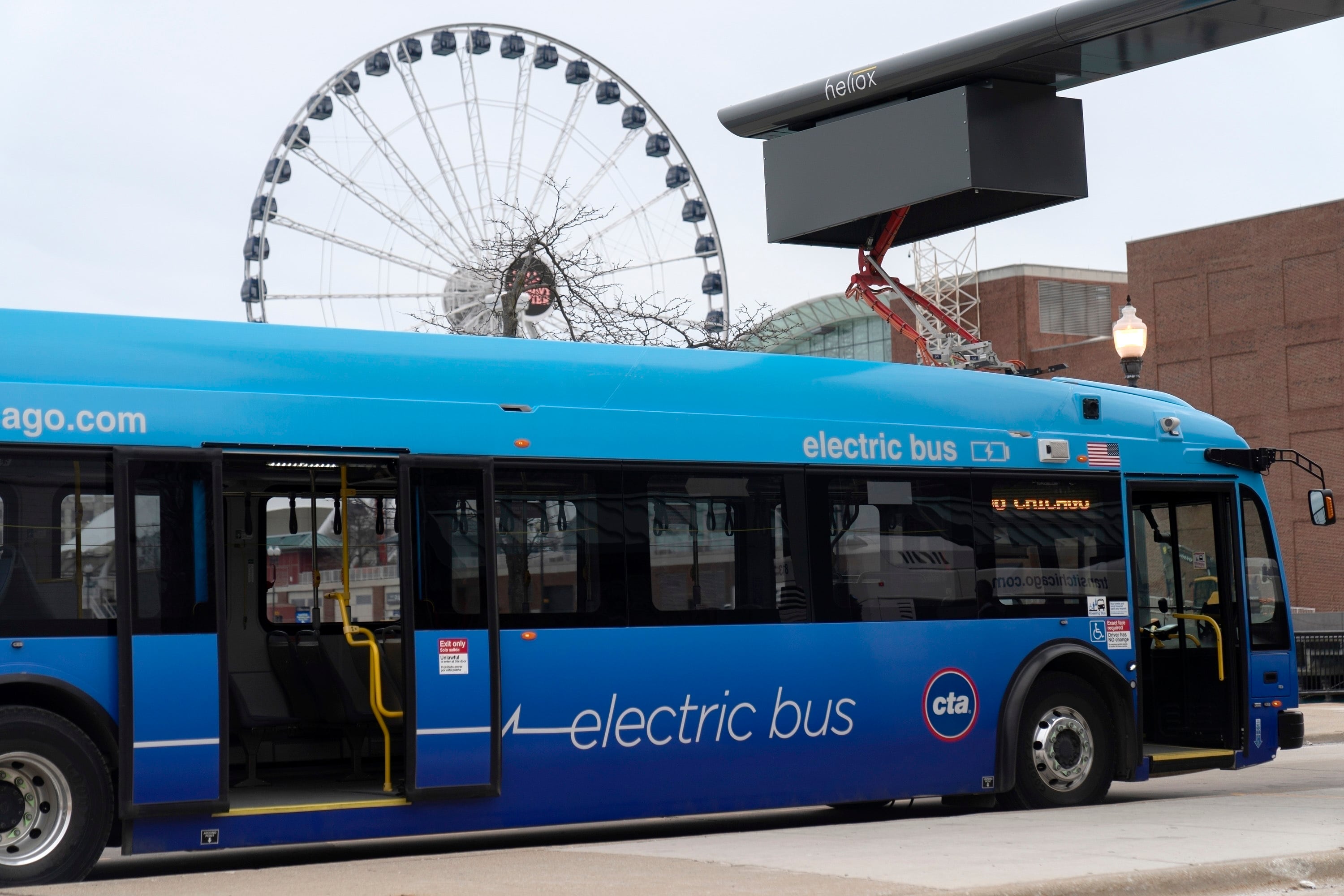 A Chicago Transit Authority electric bus charges at Navy Pier in Chicago.