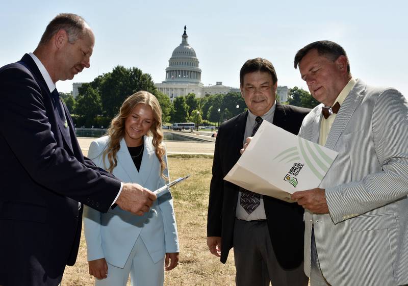 Representing the Indiana Soybean Alliance’s Membership and Policy Committee, Mike Koehne (from left), of Greensburg; Kyra Meister, Purdue University sophomore; Phil Ramsey, of Shelbyville; and Steve Howell, senior director of industry affairs for ISA and the Indiana Corn Growers Association, prepare outside the U.S. Capitol Building before meeting with congressional staffers.