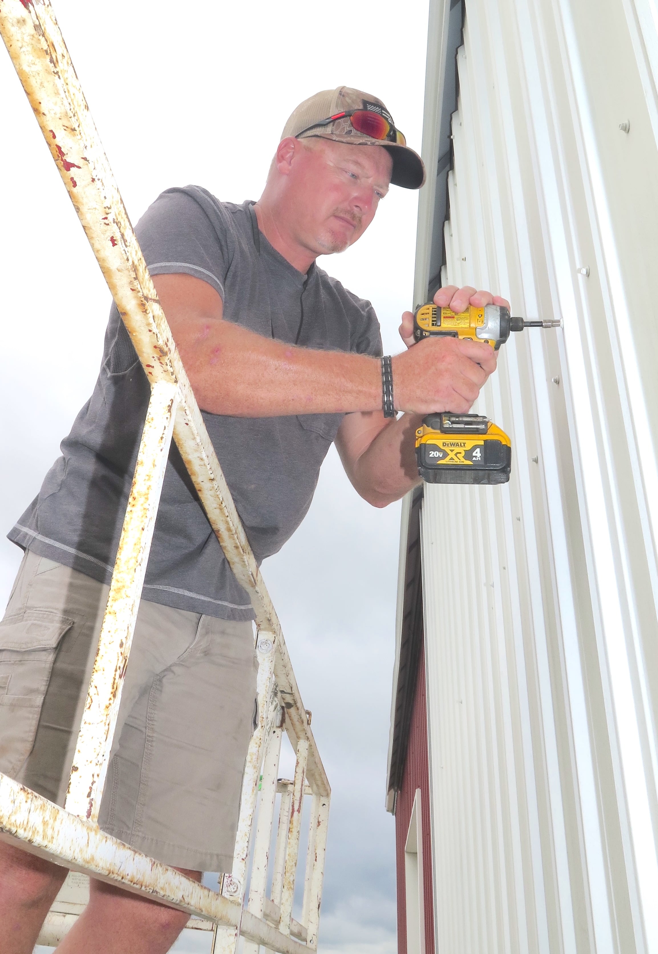 Aaron Rients began removing two sliding doors on his machine shed and will install a 16-foot by 12-foot rollup door with a remote opener.