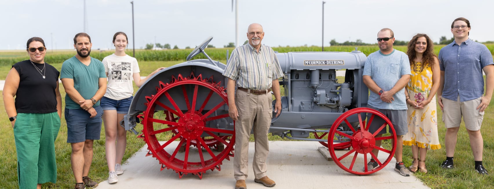 A McCormick-Deering 10-20 permanent display was unveiled in front of Heartland Community College’s state-of-the-art Ag Complex on July 30 donated by Dave Bishop. At the ceremony were family members: Hans’ wife, Katie Bishop (from left); Kristin’s husband, Jon Persangi; Graham’s girlfriend, Jaymie Cellitti; Bishop; son Hans Bishop; daughter Kristin Bishop; and son Graham Bishop.