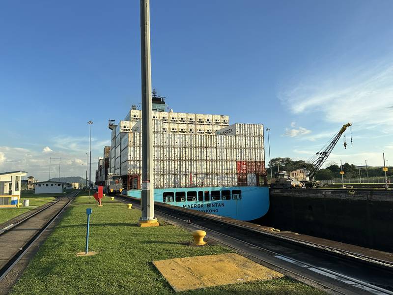 Cargo vessels pass through the Panama Canal.
