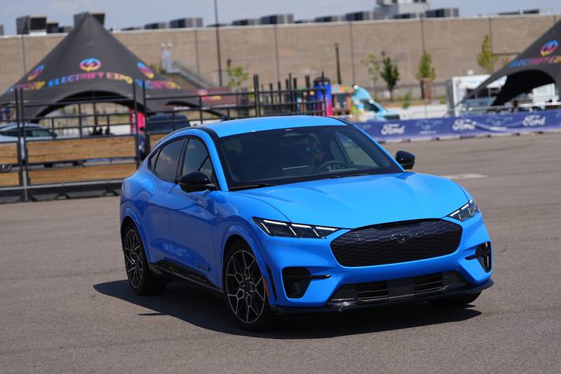 A motorist puts an electric 2024 Ford Mustang Mach-E through its paces on a test track at the Electrify Expo in The Yards Sunday, July 14, 2024, in north Denver. (AP Photo/David Zalubowski)