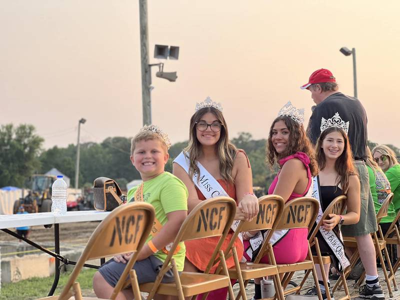 The Newton County Queen Court enjoy the Demo Derby last year.