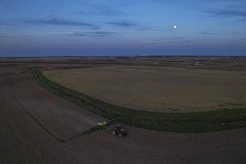 When farmers have to wait for fields to dry out, planting days can become endurance tests that stretch into the night.